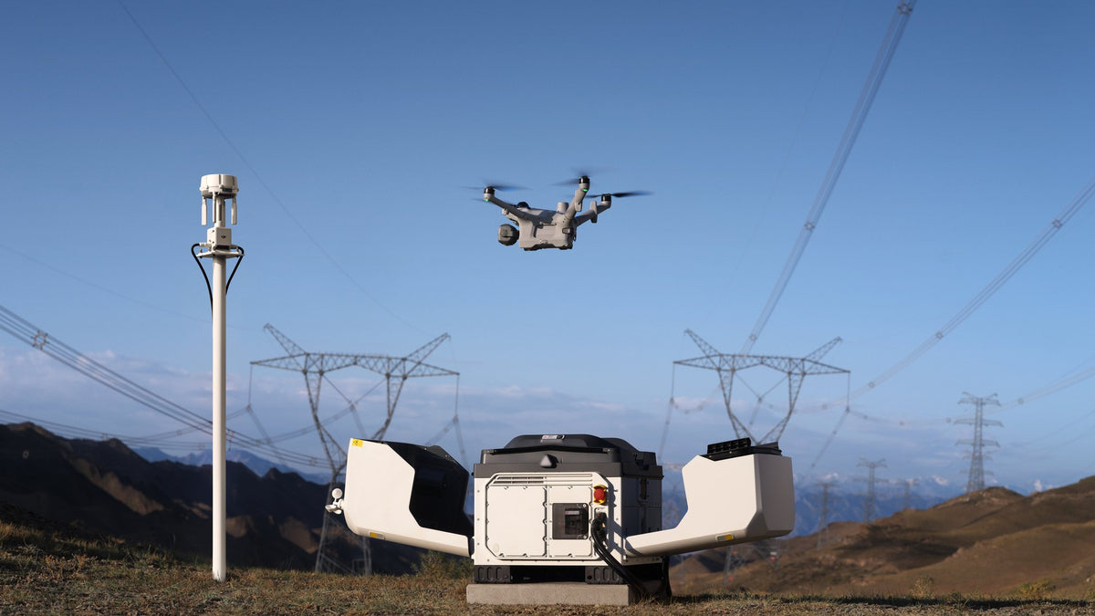 DJI Dock 4 open at a substation as the Matrice 5TD lifts off, with the O4 Ground Station on a pole beside the dock